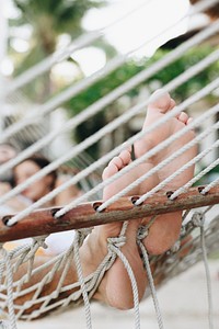 Couple resting together in a hammock