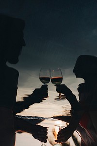 Couple drinking wine in a pool