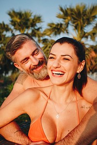 Honeymooners in a swimming pool at a resort