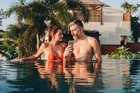 Honeymoon couple happy time in swimming pool
