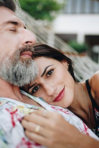 Couple resting together in a hammock