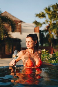 Beautiful woman relaxing in a swimming pool