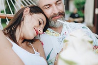 Couple resting together in a hammock