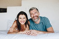 Couple spending their honeymoon in bed