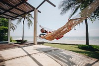 Couple relaxing in a hammock by the beach
