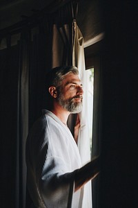 Cheerful man in a bathrobe