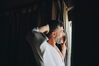 Cheerful man in a bathrobe