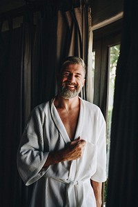 Cheerful man in a bathrobe