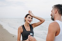 Couple exercising on a beach<br />