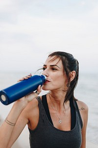 Woman drinking water after a workout