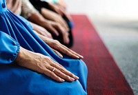 Muslim praying in Tashahhud posture