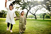 Muslim kids running in the park