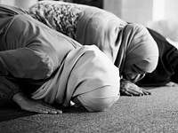 Muslim people praying in Sujud posture