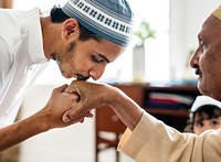 Muslim son kisses his father&#39;s hands