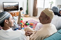 Muslim family relaxing in the home