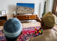 Muslim family relaxing in the home