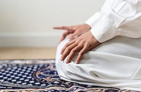 Muslim praying in Tashahhud posture