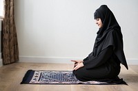 Muslim woman praying in Tashahhud posture