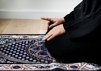 Muslim woman praying in Tashahhud posture