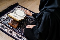 Muslim woman reading from the quran