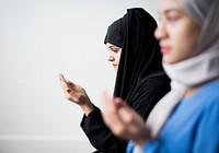 Muslim women making Dua to Allah