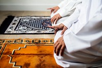 Muslim praying in Tashahhud posture