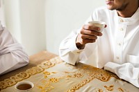 Muslim men having a cup of tea