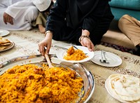 Muslim family having dinner on the floor