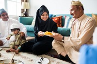 Muslim family having dinner on the floor