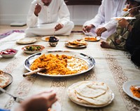 Muslim family having dinner on the floor