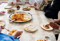 Muslim family having dinner on the floor