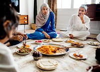 Muslim family having dinner on the floor