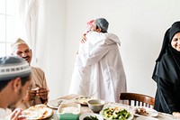 Muslim men hugging at lunchtime