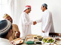 Muslim men shaking hands at lunchtime