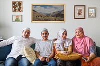 Muslim family relaxing in the home