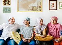 Muslim family relaxing in the home