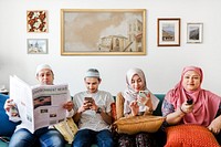 Muslim family reading the news