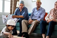 Muslim family relaxing in the home