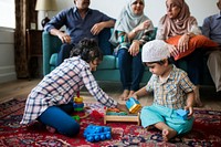 Muslim family relaxing and playing at home