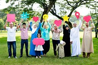 Muslim family holding up various social media icons