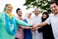 Muslim group of friends stacking hands