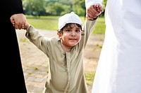 Cheerful Muslim boy in the park