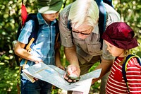 Grandfather teaching how to use a compass