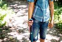 Boy hiking through a forest