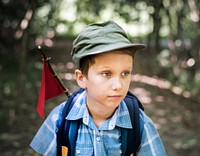 Boy hiking through a forest