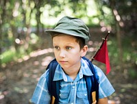 Boy hiking through a forest