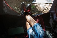 Little boy camping in the forest