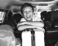 Little boy going on a holiday by car