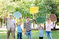 Happy family holding up speech bubbles