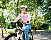 Woman enjoying a bicycle ride in the park
